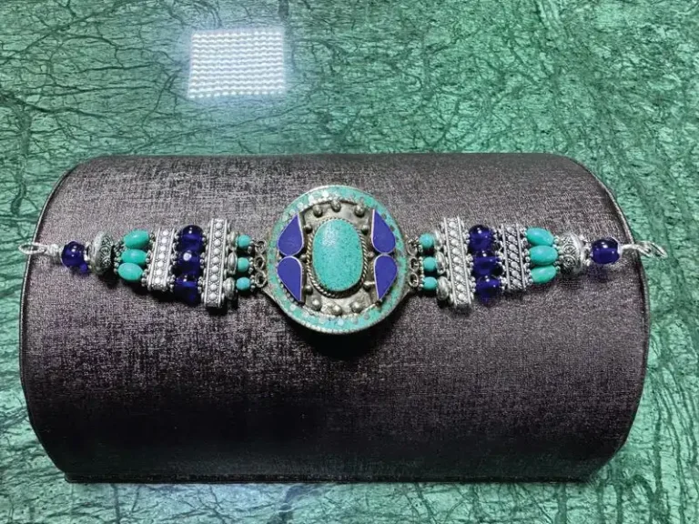 Elevate your accessory game with this stunning turquoise and blue bracelet, designed to add a pop of color to any outfit. The vibrant hues beautifully complement each other, creating a striking visual appeal that is perfect for both casual and formal occasions. Finished with a sleek silver clasp, this bracelet not only ensures durability but also provides a touch of elegance. Make a statement and express your unique style with this exquisite piece that is sure to turn heads.